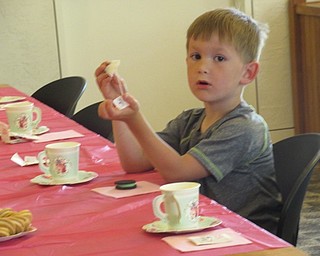 Neighbors | Jessica Harker.Children enjoyed tea, lemonade and cookies with their mothers and grandmothers May 11 at the Mommy and Me for Tea event hosted by the Austintown library.