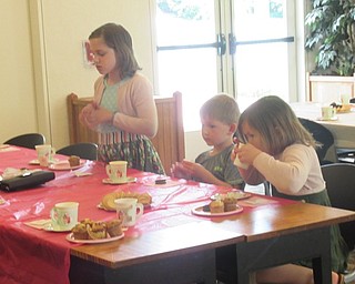 Neighbors | Jessica Harker.Children snacked on cookies and muffins along with their mom's at the Austintown library May 11 to celebrate Mother's Day.