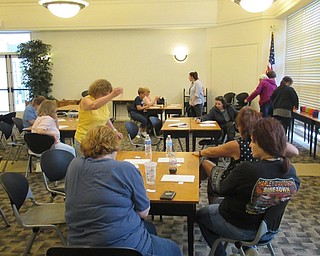 Neighbors | Jessica Harker .Community members gathered at the Austintown library on May 6 for the first string vase making event.