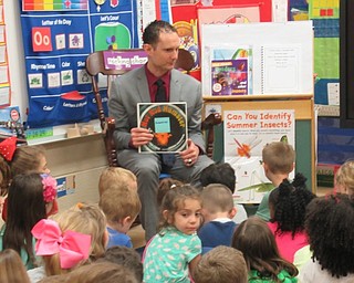 Neighbors | Jessica Harker .Drag Racer Ryan Martino read "Hot Rod Hampster" to kindergarteners at Stadium Drive Elementary School on May 9.