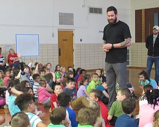 Neighbors | Jessica Harker .Chris Stanley addressed students gathered at Market Street Elementary School on May 7 during their presentation celebrating Right to Read week.