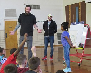 Neighbors | Jessica Harker .Market Street Elementary School student Serenity Parker volunteered during Alex LeVasseur and Chris Stanley's presentation to the school.