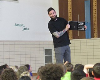Neighbors | Jessica Harker .Chris Stanley read his book "Dr. Ulysses J. Picklebottom's guide to Everyday Household Monsters (And How to Defeat Them)" to students at Market Street Elementary School.