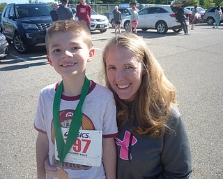 Neighbors | Submitted.The Austintown Lions included a Kids Run in the annual 5K Run on May 11. The winner of that event was Rylan Pacanowski. He is pictured with his mother, Katie.