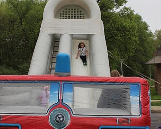 Neighbors | Abby Slanker.A Hilltop Elementary School first-grade student slid down the giant inflatable fire truck slide at  the school’s annual Student Appreciation Day on May 10.