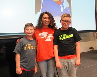 Neighbors | Jessica Harker.Connor Hoit, MCCTC student Eirini Liodakis and Spencer Hoit posed at the school's Celebration of Life event May 22.