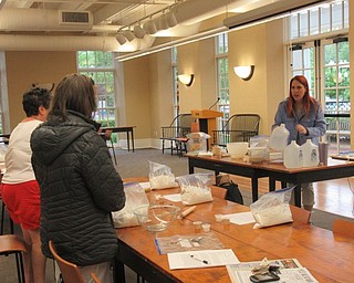 Neighbors | Jessica Harker.Community members mixed ingredients provided by th Poland library to make a no knead bread dough May 20.