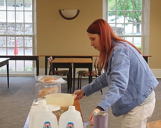 Neighbors | Jessica Harker.Librarian Missy Williams mixed ingredients to create a no knead bread dough May 20 at the Poland library.