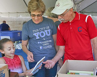 Olivia Cuevas of Boardman, 7, and her grandfather  Jose Calderon were among those who saw numerous bargains, thanks to Friday’s six-hour Jewelry and Book Tent Sale at Goodwill Industries Inc., 2747 Belmont Ave.
Hosting the event was the Junior Group of Goodwill. With them is Barb Metzendorf of Goodwill.
