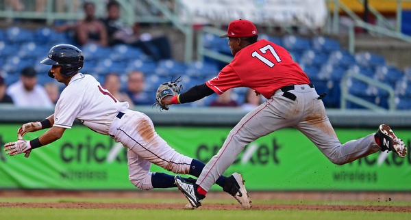 NILES, OHIO - JUNE 28, 2019: Scrappers' Brayan Rocchio is tagged out by Muckdogs' Dalvy Rosario after being caught in a pickoff in the third inning of their game, Friday night at Eastwood Field. DAVID DERMER | THE VINDICATOR