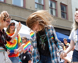 From left, Ely Kendall, 15, of Boardman, Jay Quen, 13, of Springfield, Avery Hodgson, 14, of Trevor, Wisconsin, and Georgia Kirkbride, 13, of Indianapolis, Indiana, dance at the 11th annual Pride parade and festival in downtown Youngstown on Saturday afternoon. EMILY MATTHEWS | THE VINDICATOR