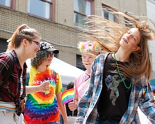 From left, Ely Kendall, 15, of Boardman, Jay Quen, 13, of Springfield, Zofia Rumbalski, 13, of Youngstown, and Avery Hodgson, 14, of Trevor, Wisconsin, dance at the 11th annual Pride parade and festival in downtown Youngstown on Saturday afternoon. EMILY MATTHEWS | THE VINDICATOR