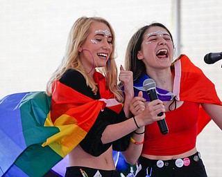 Tina Collins, left, and Katelyn Maniscalco, both of Youngstown, sing Lizzo's Truth Hurts during a karaoke competition at the 11th annual Pride parade and festival in downtown Youngstown on Saturday afternoon. EMILY MATTHEWS | THE VINDICATOR