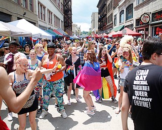 The crowd dances at the 11th annual Pride parade and festival in downtown Youngstown on Saturday afternoon. EMILY MATTHEWS | THE VINDICATOR