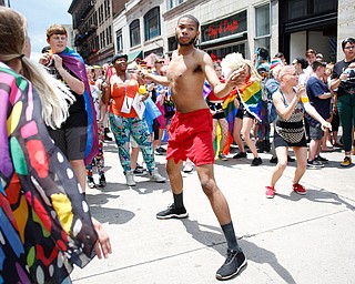 Louis Brown, of Youngstown, dances with the crowd at the 11th annual Pride parade and festival in downtown Youngstown on Saturday afternoon. EMILY MATTHEWS | THE VINDICATOR