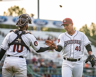 DIANNA OATRIDGE | THE VINDICATOR Mahoning Valley catcher Eric Rodriguez (10) congratulates pitcher Jhonneyver  Guitierrez (40) after striking out a batter to end the inning during their game against Batavia at Eastwood Field on Saturday night.
