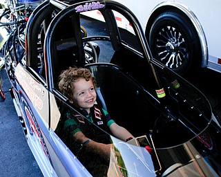 Robert "Obie" Alden, 4, of Niles, sits in PDRA world champion Tom Martino's Top Dragster at the Mahoning Valley Corvette Club's 25th Annual Corvette and Steel Car Show at Greenwood Chevrolet in Austintown on Sunday. EMILY MATTHEWS | THE VINDICATOR