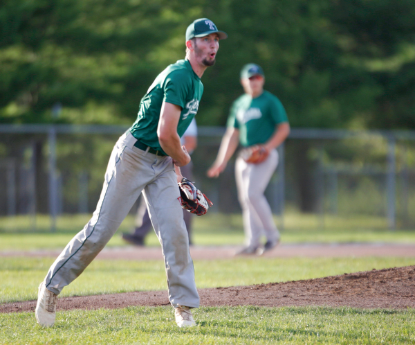 The Stark County Terriers' Aaron Miller reacts after over-throwing the ball to first during their game against the Astro Falcons at Bob Cene Park on Sunday. EMILY MATTHEWS | THE VINDICATOR