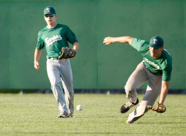 The Stark County Terriers' Alex Hawkins, left, and Tyler Urconis go after the ball during their game against the Astro Falcons at Bob Cene Park on Sunday. EMILY MATTHEWS | THE VINDICATOR