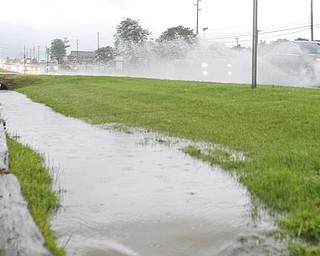 Heavy rain fell several times last month in the Mahoning Valley, making it the fourth-wettest June in the area on record. This is the ponding and full ditches on Market Street in Boardman after a heavy rain in early June. 