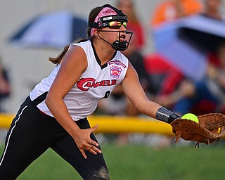 BOARDMAN, OHIO - JULY 2, 2019: Canfield's Katie Kouliaanos catches a fly ball for the out in the second inning of their game, Tuesday night against Boardman at the Field of Dreams. Boardman's Sophia Rivera would be out on the play. Canfield won 6-1. DAVID DERMER | THE VINDICATOR
