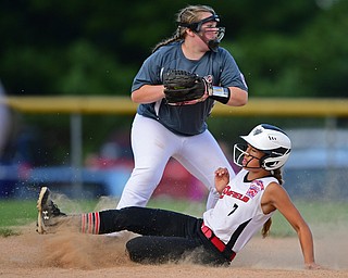 BOARDMAN, OHIO - JULY 2, 2019: Canfield's Caley Selley is forced out at second base by Boardman's Lily Hasse in the second inning of their game, Tuesday night against Boardman at the Field of Dreams. Canfield's Katie Koulianos would be safe at first. Canfield won 6-1. DAVID DERMER | THE VINDICATOR