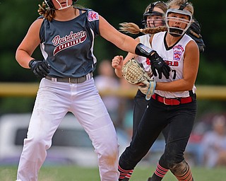 BOARDMAN, OHIO - JULY 2, 2019: Canfield's Katie Koulianos, left, reacts after tagged out by Canfield's Caley Salley after attempting to steal second base in the third inning of their game, Tuesday night against Boardman at the Field of Dreams. Canfield won 6-1. DAVID DERMER | THE VINDICATOR
