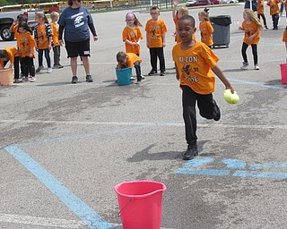 Neighbors | Jessica Harker .Kindergarten students participated in the firemans relay May 15 at the schools annual Fun Day celebration.