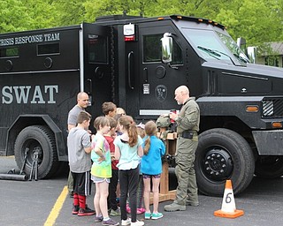 Neighbors | Abby Slanker.Students at Hilltop Elementary School listened as a member of the S.W.A.T. Crisis Response Team talked about his career at the school’s annual Vehicle Career Day on May 17.
