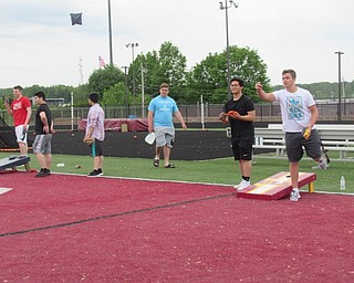 Neighbors | Jessica Harker.Graduating seniors at Boardman High School played a number of games, including corn hole, at the schools stadium May 22, during the annual Field Day event.