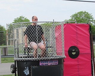 Neighbors | Jessica Harker.Boardman teachers and administrators took turns in the dunk tank May 22, allowing graduating seniors to take turns trying to dunk them into the water.