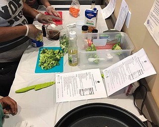 Neighbors | Submitted.Robin Adams with the Ohio State Expanded Food and Nutrition Education Program taught community members a new healthy recipe every week for free at the Austintown Farmers Market.
