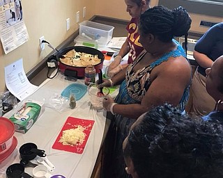 Neighbors | Submitted.The Ohio State Expanded Food and Nutrition Education Program Assistant Robin Adams taught new healthy recipes to community members at the Austintown Farmers Market.