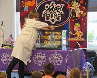 Neighbors | Jessica Harker .Representatives from Mad Science performed for children gathered at the Canfield library June 28.
