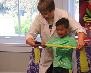 Neighbors | Jessica Harker .Children learned how astronauts exercise at the Canfield library June 28 during the Mad Science demonstration.
