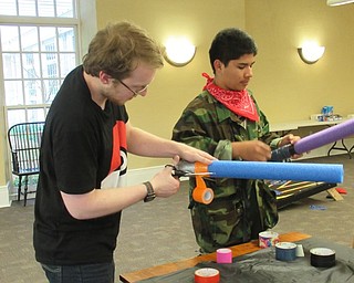 Neighbors | Jessica Harker .The Poland library provided supplies for teenagers to create their own lightsabers to battle with at the Guardians of the Stars and Universe event June 25.