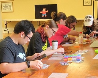 Neighbors | Jessica Harker .Teenagers at the Poland library worked to create bead art during the Guardians of the Stars and Universe Space Fandom Mash-Up event.