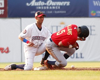 The ball gets past Scrappers' Brayan Rocchio as the Spikes' Donivan Williams makes it safely to second during their game at Eastwood Field on Thursday. EMILY MATTHEWS | THE VINDICATOR
