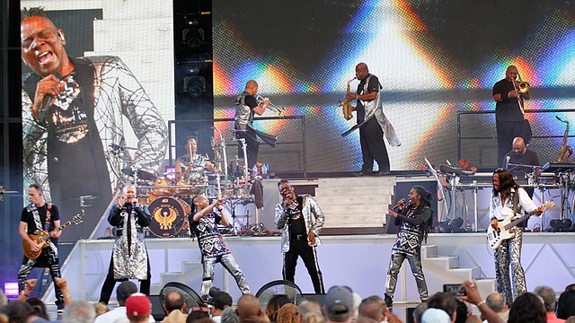 Philip Bailey, center, belts out one of the hits from legendary R&B, pop-funk band Earth, Wind & Fire at the Youngstown Foundation Amphitheatre on Friday night. EW&F hits include “Reasons,” “Shining Star,” “September,”  “Boogie Wonderland,” and “Keep Your Head to the Sky.”
