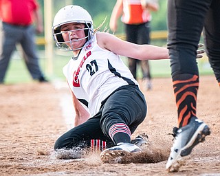 DIANNA OATRIDGE | THE VINDICATOR  Canfield's Leah Figueroa slides safely into home during their game against Howland in the 10U tournament in Boardman on Friday.