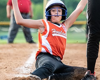 DIANNA OATRIDGE | THE VINDICATOR  Howland's Maya Kubancsek slides safely into home during their 10U tournament game versus Canfield in Boardman on Friday.