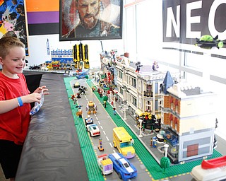 Grayson Hepburn, 5, of Noblesville, Indiana, looks at a Legos town made by members of NeoLUG, a group of adult hobbyists who share their passion for building with Legos, at the Youngstown Comic Con in Covelli Centre on Saturday afternoon. EMILY MATTHEWS | THE VINDICATOR