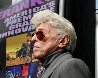 Jim Steranko, a graphic artist, stands behind his table where he was meeting and talking with fans at the Youngstown Comic Con in Covelli Centre on Saturday afternoon. EMILY MATTHEWS | THE VINDICATOR