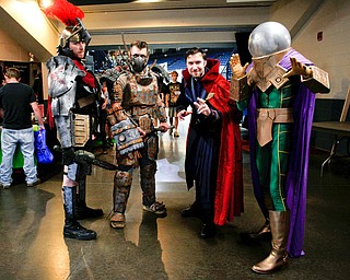From left, Brennan Lowmaster, dressed as Centurion, Shane Pieplow, dressed as Ralo from Fallout, Caleb Pieplow, dress as Dr. Strange, and Carl Sopkovich, dressed as Mysterio, pose for a photo at the Youngstown Comic Con in Covelli Centre on Saturday afternoon. EMILY MATTHEWS | THE VINDICATOR