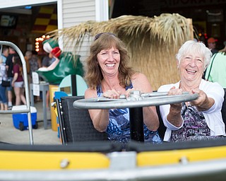 Alice Swarts, left, and Mary Ann Holland, both of Alliance, sit in a replica of the turtle ride at the Idora Park experience on Sunday. EMILY MATTHEWS | THE VINDICATOR