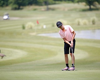 Rocco Turner, 14, of Poland, putts the ball during the Greatest Golfer junior qualifier at Salem Hills Golf Club on Tuesday. EMILY MATTHEWS | THE VINDICATOR