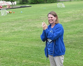 Neighbors | Jessica Harker.Austintown Community Church Preschool director Amy Teeters clapped for students as they performed for the community members gathered at the school May 21 to celebrate it's 50th anniversary.