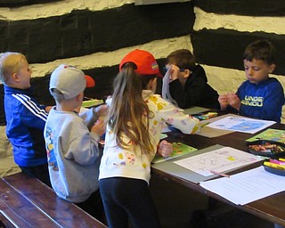 Neighbors | Jessica Harker .Park Pals summer camp met in the Old Log Cabin at Mill Creek Park June 14, kicking off the event with coloring.