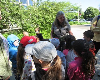 Neighbors | Jessica Harker .Naturalist Marilyn Williams instructed children on how to complete a color scavenger hunt June 14 for the last day of the Park Pals summer camp.
