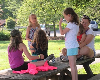 Neighbors | Jessica Harker .A counselor sat with a group of children during the Boardman Park's Adventure Day Camp on June 27.